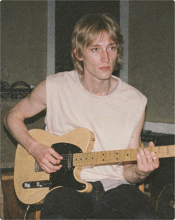 A musician playing an electric guitar