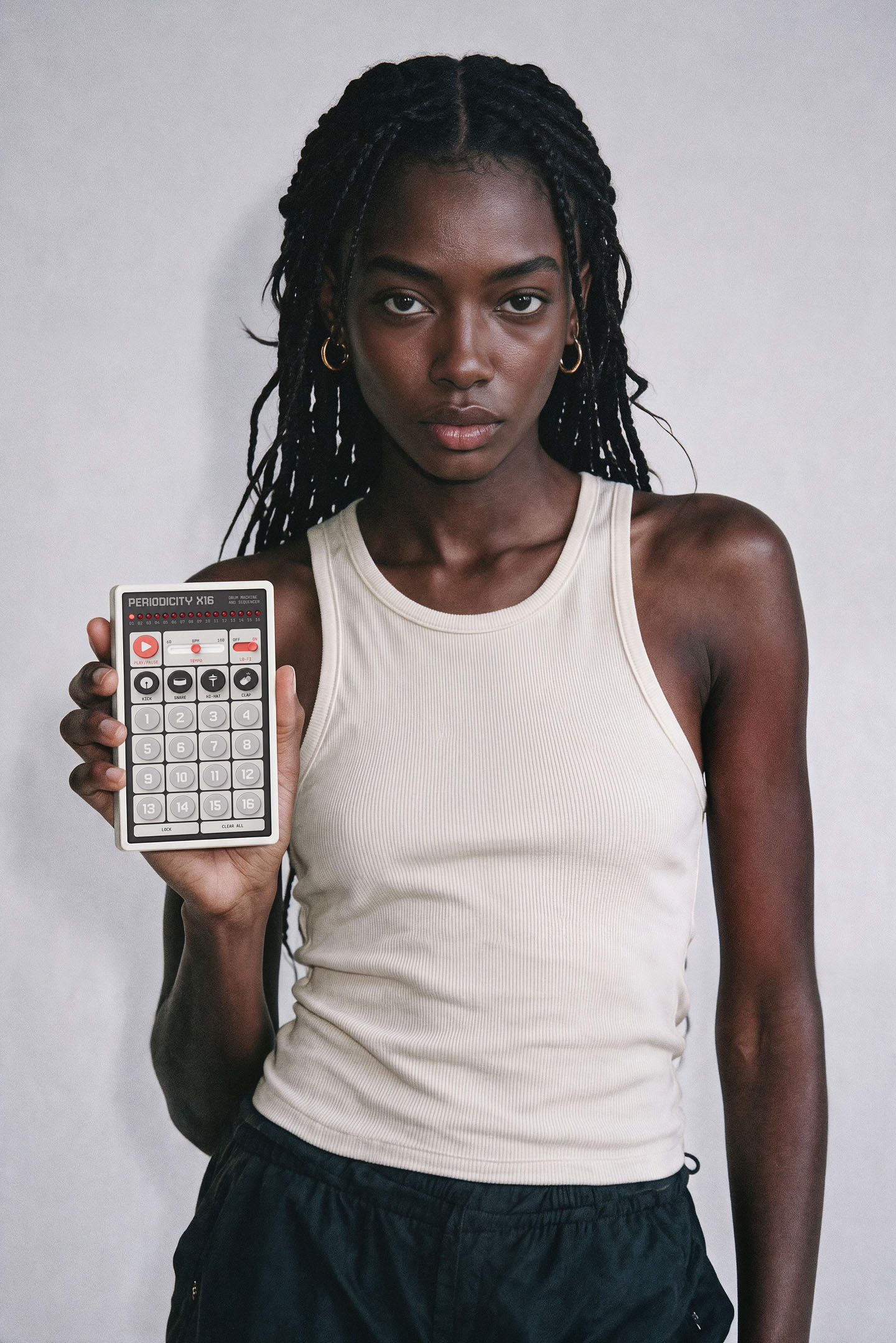 A musician holding the Periodicity X16