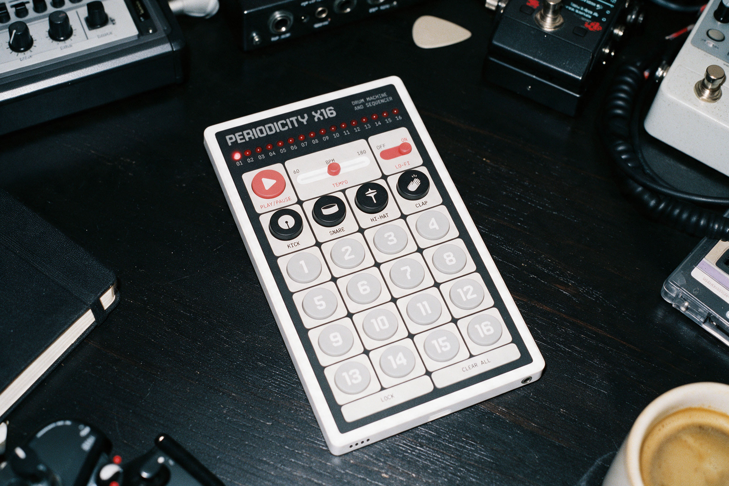 Periodicity X16 on a studio desk surrounded by music equipment